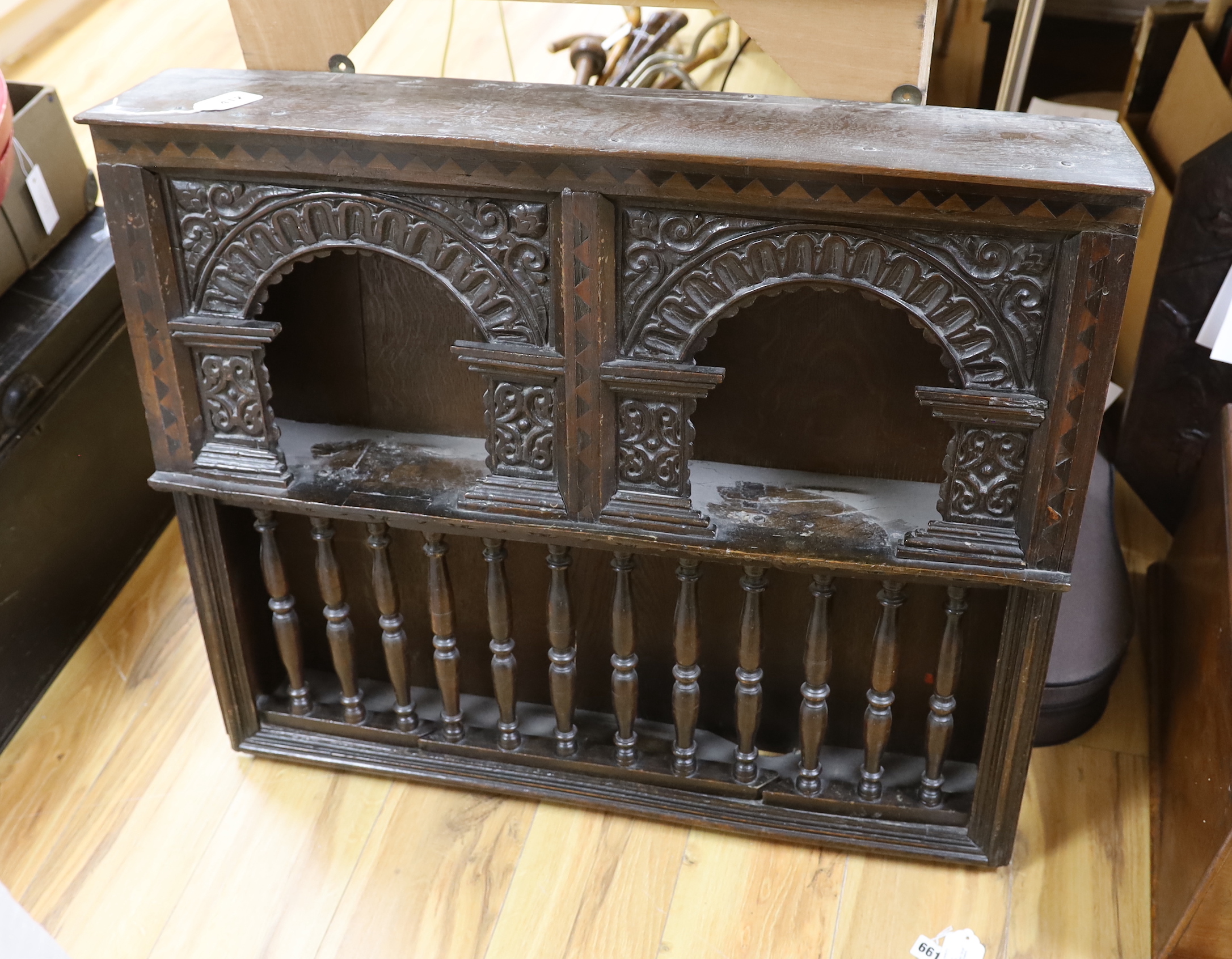 A 17th century and later inlaid bog oak wall cupboard, 82cm wide, 69cm tall, 16cm deep